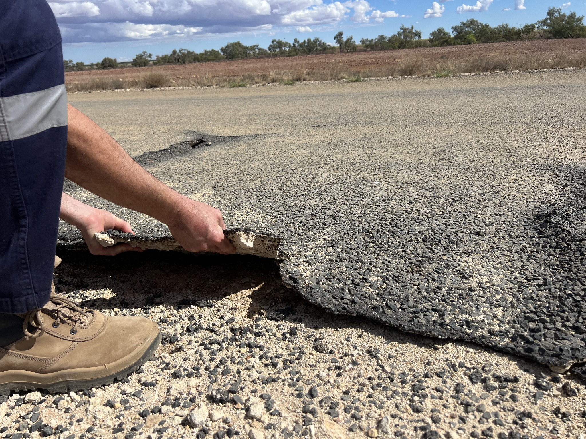 Flood-damaged spray seal pavement failure in Queensland